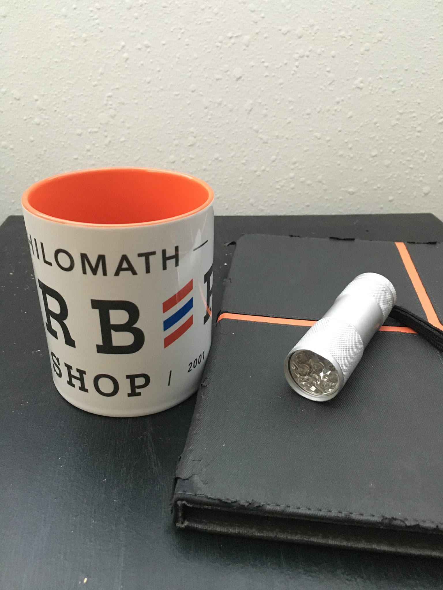 Philomath Barber Shop mug on a counter